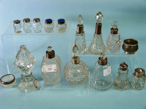A collection of silver mounted cut glass Scent Bottles, together with a pair of small silver and