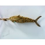 A silver gilt Pendant / Vinaigrette, formed as a filigree articulated fish set with turquoise