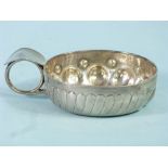 A French silver 'Tastevin' or Wine Tasting Cup, of circular form with loop handle and thumb piece,