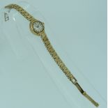 A 9ct yellow gold ladies Rotary Wristwatch, with white enamel and gold dial, on a flexible 9ct