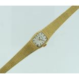 A 9ct gold Nivada lady's Wristwatch, with Swiss movement and integral 9ct gold flexible textured