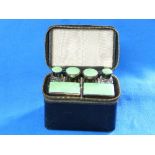 An cased early 20thC guilloche enamel mounted glass six bottle/box Vanity Set, comprising two