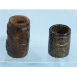 A mottled brown Chinese archaic style hardstone Cong, of cylindrical form, 3½in (9cm) high, together