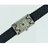 A French platinum and diamond lady's Cocktail Watch, of rectangular form, the silvered dial with