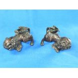 A pair of 18thC Chinese bronze Dogs of Foo, Ching dynasty, of traditional form, formerly with stands