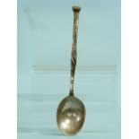 An Arts & Crafts hammered silver Spoon, by Omar Ramsden, hallmarked London, 1927, the stem with