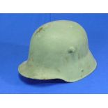 A W.W.2 style German Steel Helmet, repainted, lacks lining, etc.