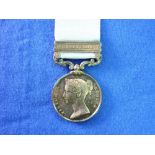 Army of India Medal, with Bhurtpoor clasp, inscribed to: T. Grehan. 59th Foot, with ribbon.