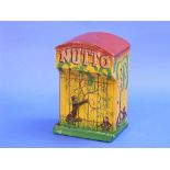 A 'Nutto' performing Monkey in a Cage Toy, c.1950`s, approximately 8½in (22cm) high.