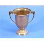 A George V silver two handled Trophy Cup, by William Neale, hallmarked 1932, with scroll handles and