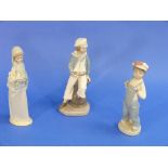 Three Lladro porcelain figures, including no.4810 Boy with Yacht and Boy with Overalls (3)