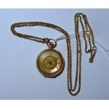 A 15ct gold ladies Fob Watch / Pocket Watch, with ornate foliate engraved case, the gilt dial with