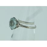 A singe stone circular facetted aquamarine Ring, all mounted in platinum.