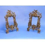 A pair of Rococo style bronzed metal easel Frames, Rd. No. 553836, of pierced architectural form,
