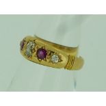 A five stone ruby and diamond Ring, the central oval diamond with a circular ruby and diamond on