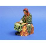 A Royal Doulton porcelain 'Fortune Teller' figure, H.N.2159, green/brown, 6½in (16.5cm) high.