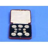 A cased set of George VI silver Buttons, by Bs & Co., hallmarked London, 1939, comprising six larger