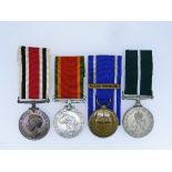 Four various medals, comprising Special Constabulary Long Service medal to Irving Whitham, Africa