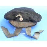 A Nazi Kreigsmarine sailors cap, the lining inscribed in ink "Rudolf Bunhgard UN.54399??", damaged