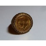 A George V gold Sovereign, dated 1925, mounted in a 9ct gold gentleman's ring.