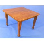 An Arts & Crafts oak extending Dining Table, with one additional leaf, the top with canted corners