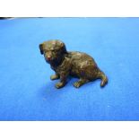A 19thC French bronze figure of a seated Dog, the base with registration mark and impressed
