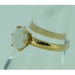 A single stone oval opal Ring, mounted in 9ct yellow gold, Size L.