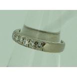 A diamond set half hoop Eternity Ring, mounted in 18ct white gold, Size M.