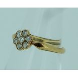 A small pretty diamond cluster Ring, mounted in 18ct yellow gold, Size L.