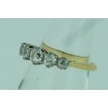 A graduated five stone diamond Ring, mounted in yellow gold marked 750, Size O.