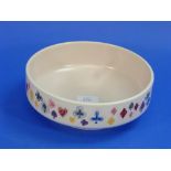 A Poole Pottery Waddington bowl, decorated with playing card motifs, 8¾in (22cm) diameter.