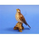 A Beswick pottery Song Thrush, MN.2308, gloss, beak restored, 6in (15.25cm) high, and a Beswick