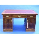 An Arts and Crafts mahogany Pedestal Desk, in the Scottish-School style, the doors with long