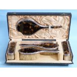 A George silver and tortoiseshell mounted five piece Dressing Table Set, by James Deakin & Sons,