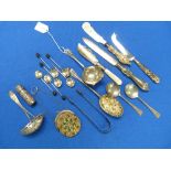 A collection of Silver Items, including an Elizabeth II strainer spoon, hallmarked Sheffield 1957,
