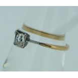A small single stone diamond Ring, the oval facetted stone, c0.4ct, set in a square mount, in