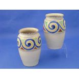 Honiton Pottery; a matched pair of vases decorated in a band of yellow and blue swirl pattern around