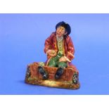 A Royal Doulton porcelain 'In the Stocks' figure, H.N.2163, red/brown, 6in (15.25cm) high.