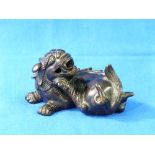 A 19thC oriental bronze Fu Dog, 3½in (9cm) long.