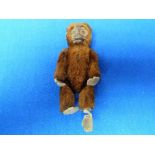 A Schuco monkey Scent Bottle, with mohair body and internal glass bottle, 4½in (11.5cm) high.