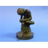 A late 19thC bronze figure of Boy with thorn, or Spinario, on circular base, 9in (23cm) high.