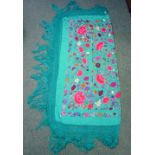 An embroidered Chinese piano shawl, the turquoise silk ground embroidered in brightly coloured