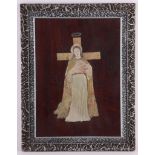 A 20th Century alabaster relief of Jesus, set on to wooden background, framed.