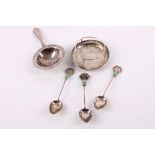 An early 20th Century antique Chinese silver tea strainer and stand,  with engraved decoration of