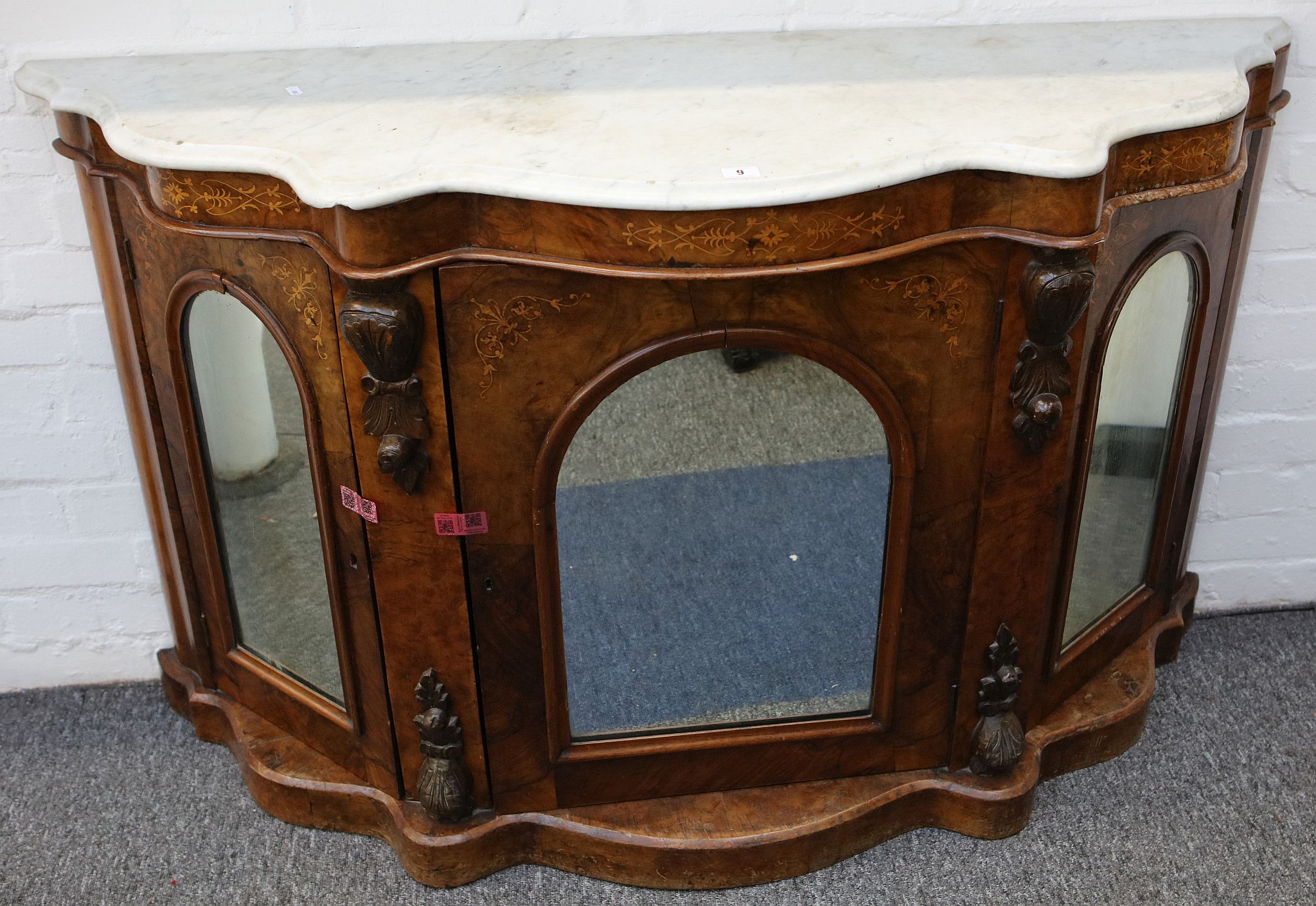 A Victorian walnut and marquetry inlaid marble top credenza, 137cm wide.