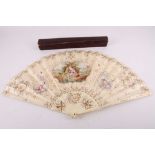 A 19th Century ladies fan by Nathalie of Sloane Street, ivory sticks with a hand painted paper