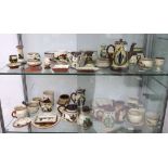 An early 20th Century collection of over 50 pieces of Torquay - Watcombe earthenware Motto ware