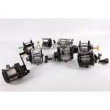 A collection of sea fishing reels; a Penn Commander Zolc, Okuma BTL903, Ocean CHY 981, Pen 320GT,