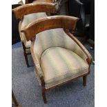 Three stained armchairs having wide top rails, fluted scrolling arms and carved tapering legs,