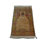 A fine Turkish silk Hereke rug with metal thread, 1.61m x 1.03m, condition rating A.